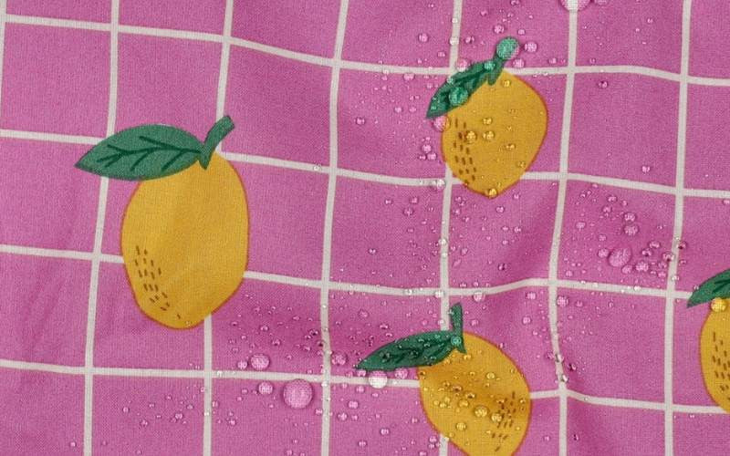 Tela impermeable Limones Rosa